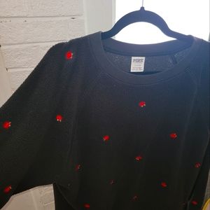 Black sweater with red roses